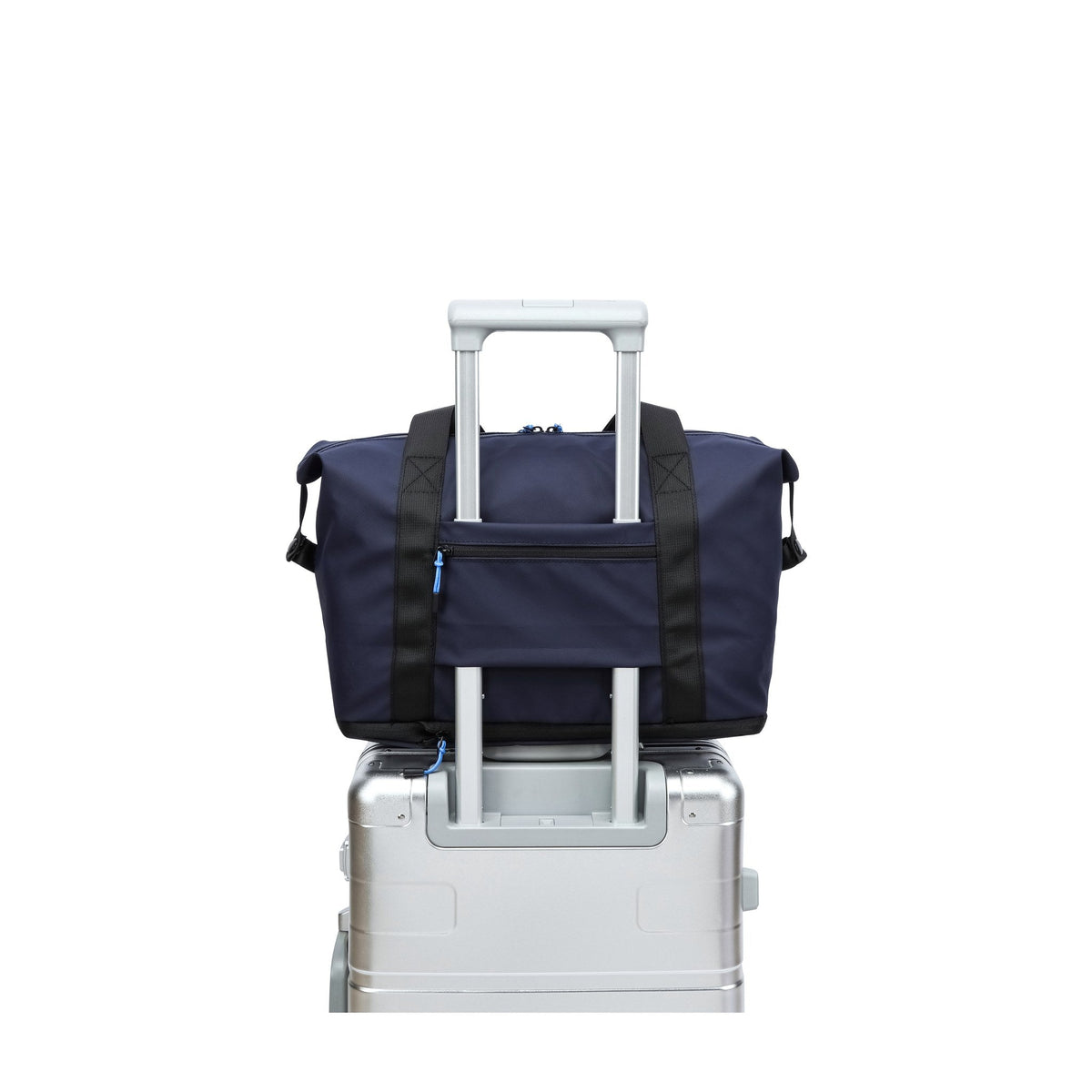 Navy — Voyager Shoulder Bag, on a case's trolley handle